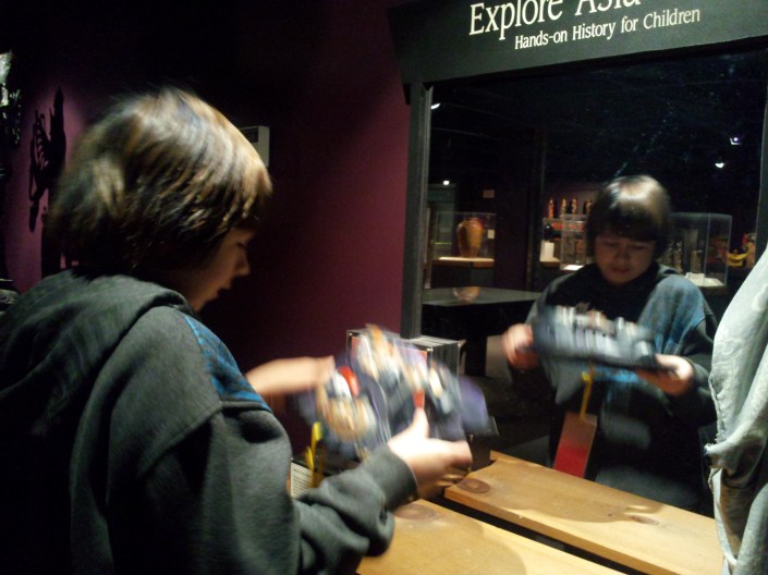 Austin in the Mirror, Asian Exhibit (Berman)